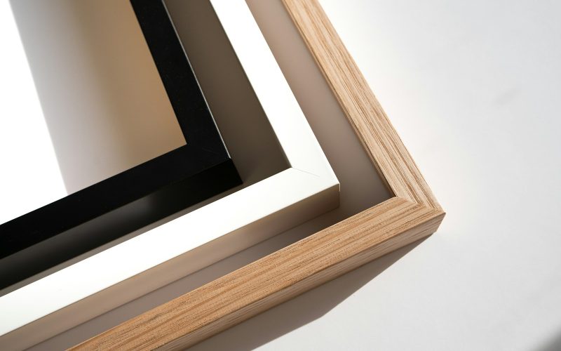 a wooden frame with a black and white picture in it